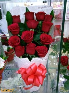 Natural red roses bouquet - green leaves