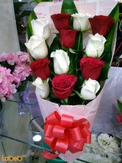 Natural Roses bouquet - white and red - green leaves in background